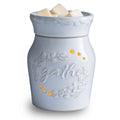 White wax warmer with 'gather' text and decorative elements on a white background
