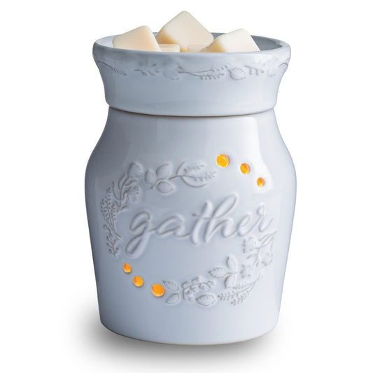 White wax warmer with 'gather' text and decorative elements on a white background