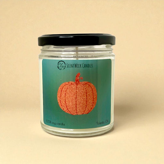Taylor Swift jar candle with pumpkin design label on a beige background