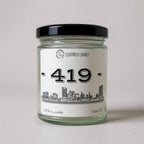 ScentWick Candle jar labeled '419' with a Toledo cityscape design on a light gray background