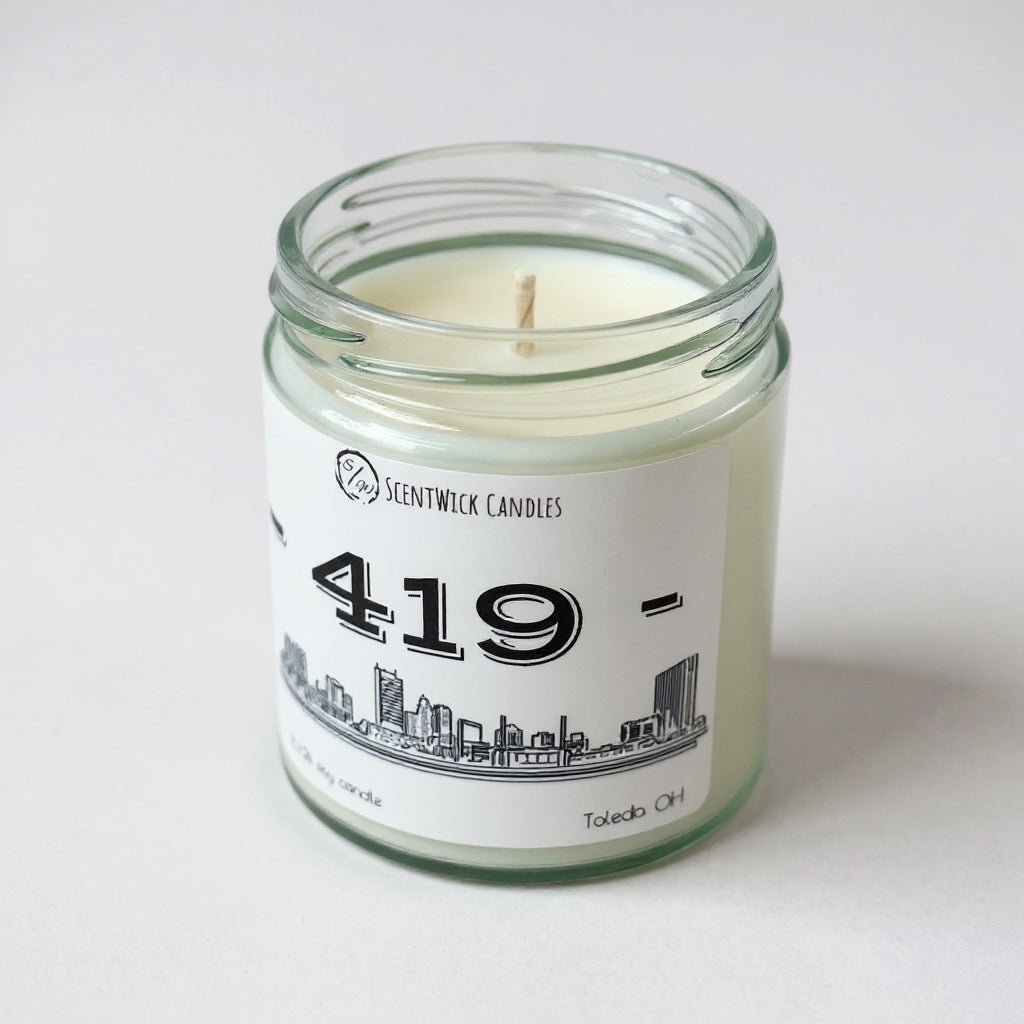 Scentwick Candles 419 Toledo Ohio candle in a glass jar on a white background